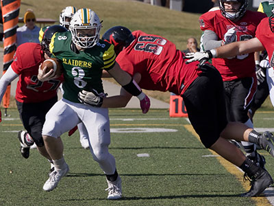At this level of football, volunteers had to be recruited to hold the orange sticks seen in the background.