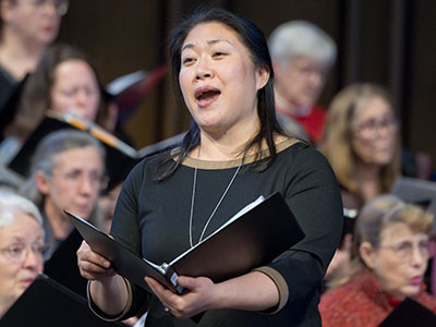 Ryu Kyung Kim rehearses with the Bach Society of Dayton.