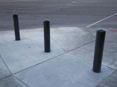 Three monoliths suddenly appeared on the sidewalk.