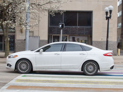 The driver who tried to kill me today (note the crosswalk sign).