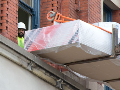 I couldn`t wait around to see how those building materials were going to get through that window.