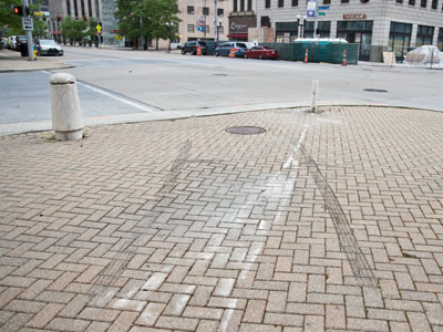 I stand on this corner every day, but fortunately not when some idiot driver drove up onto the sidewalk.