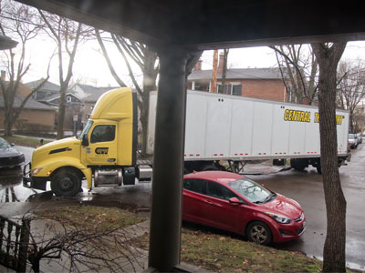 The trucker`s dilemma:  how to make the turn in front of my house.  Fortunately, my car is nowhere nearby.