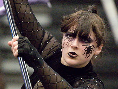 The color guard grandpa next to me said, `This must be a tough school.  All of them have tattoos on their faces.`