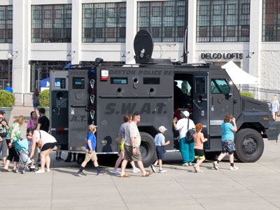 Only in America:  this family event featured tours of the SWAT and Bomb Squad vehicles.  Children posed for photos wearing bulletproof vests.