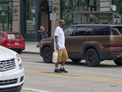 A lady beside me yelled, `GET OUT THA STREET!`