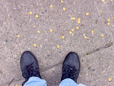 There was a breakfast cereal explosion on the sidewalk.
