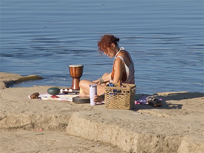 She had a variety of percussion instruments and seemed to be playing a concert for the gulls. She had a variety of percussion instruments and seemed to be playing a concert for the gulls.