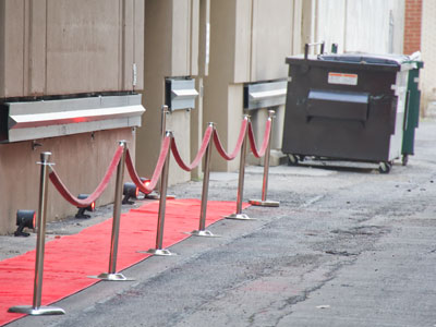 A red carpet to the dumpster.  It`s all about glamor here.