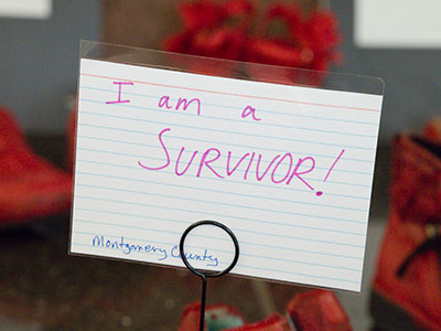 The red shoes were painted by local women who are survivors of domestic violence.