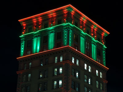 Ancient pagan festivals used fir trees and holly to ward off evil, so green and red were adapted for Christmas.